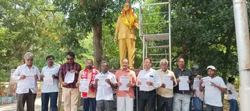 CPM leaders unveiling a pamphlet