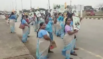 Anganwadi workers protest during Minister Lokesh's visit.