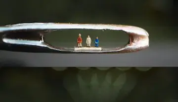 Space-age honor for Indian sculpture... three great figures within the eye of a needle!