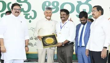Commissioner Balaswamy receives 'Clean Sweep' award from CM Chandrababu.