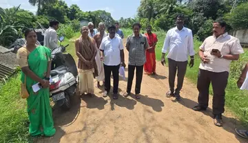 District Endowment Officer inspects leased lands of the Banana Research Station.