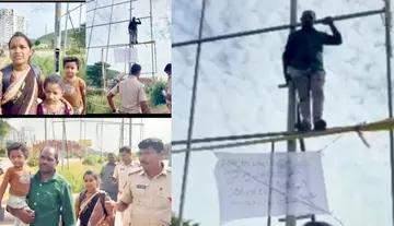 Man climbs flex banner scaffolding seeking justice.