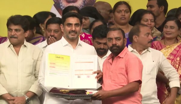 Minister Lokesh distributed house site pattas to beneficiaries.