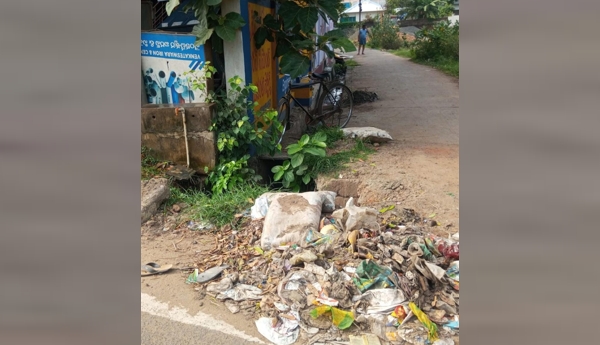 Contaminated drinking water... a drain right next to it... accumulating garbage...