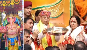 Governor and his wife perform the first puja to the 69-foot Khairatabad Maha Ganapati.