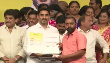 Minister Lokesh distributed house site pattas to beneficiaries.