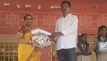 A teacher providing facilities to students alongside education.