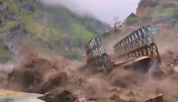 Flood Havoc – Massive Steel Bridge Swept Away in Seconds!