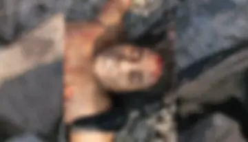 Unidentified woman dies after being hit by a train.